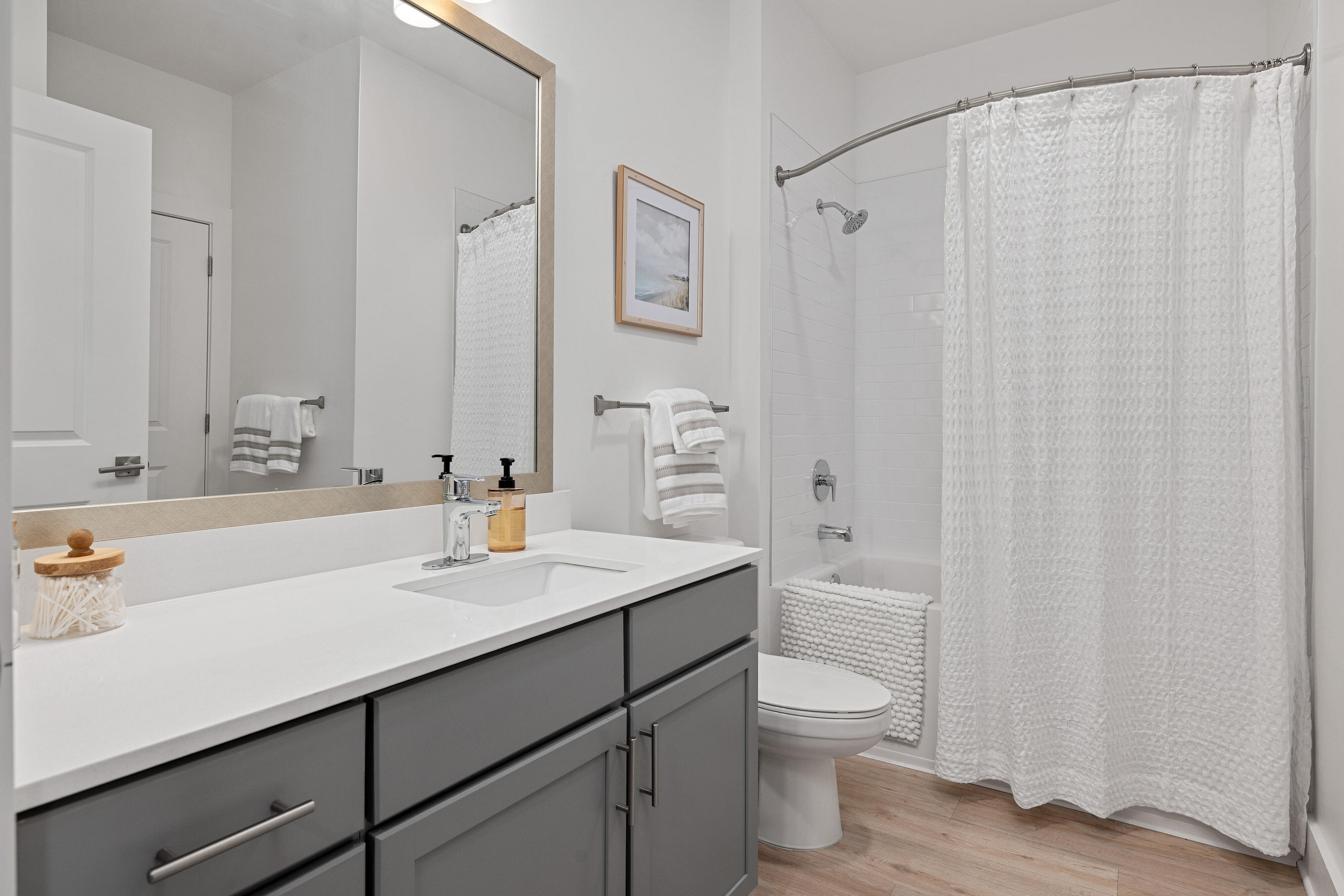 bathroom with gray cabinets