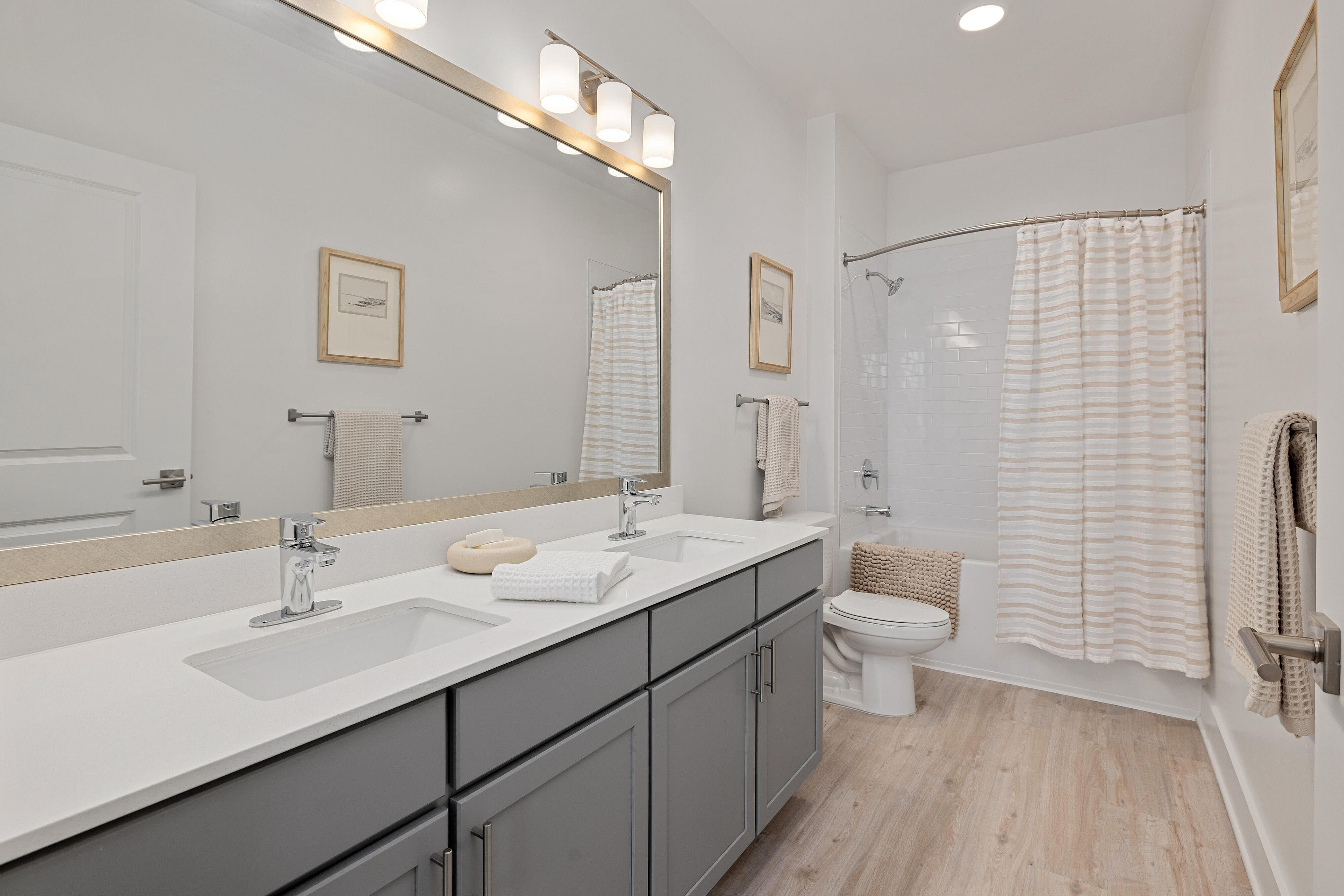 bathroom with gray cabinets