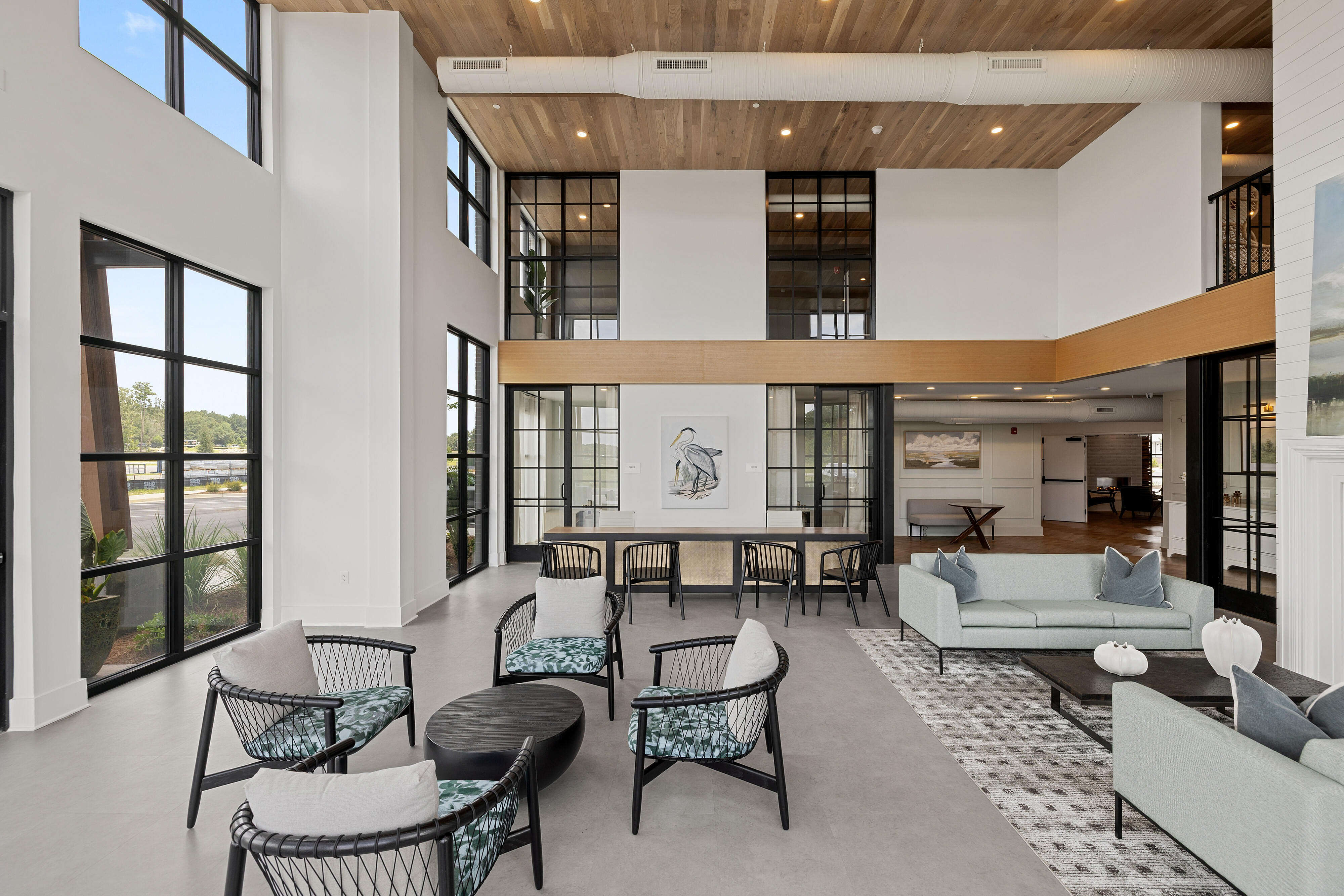 interior of community with seating area and large windows