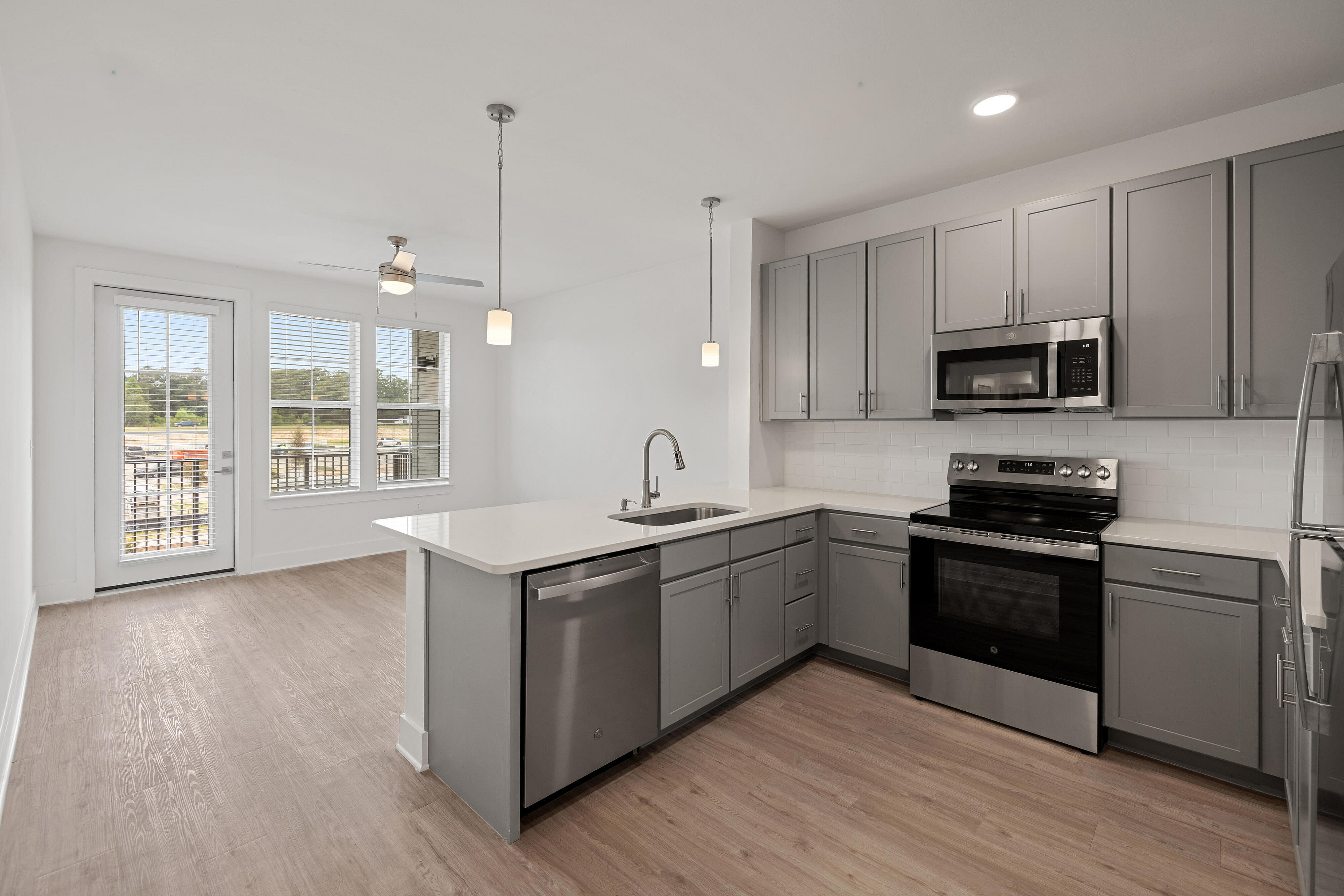 vacant kitchen with gray cabinets