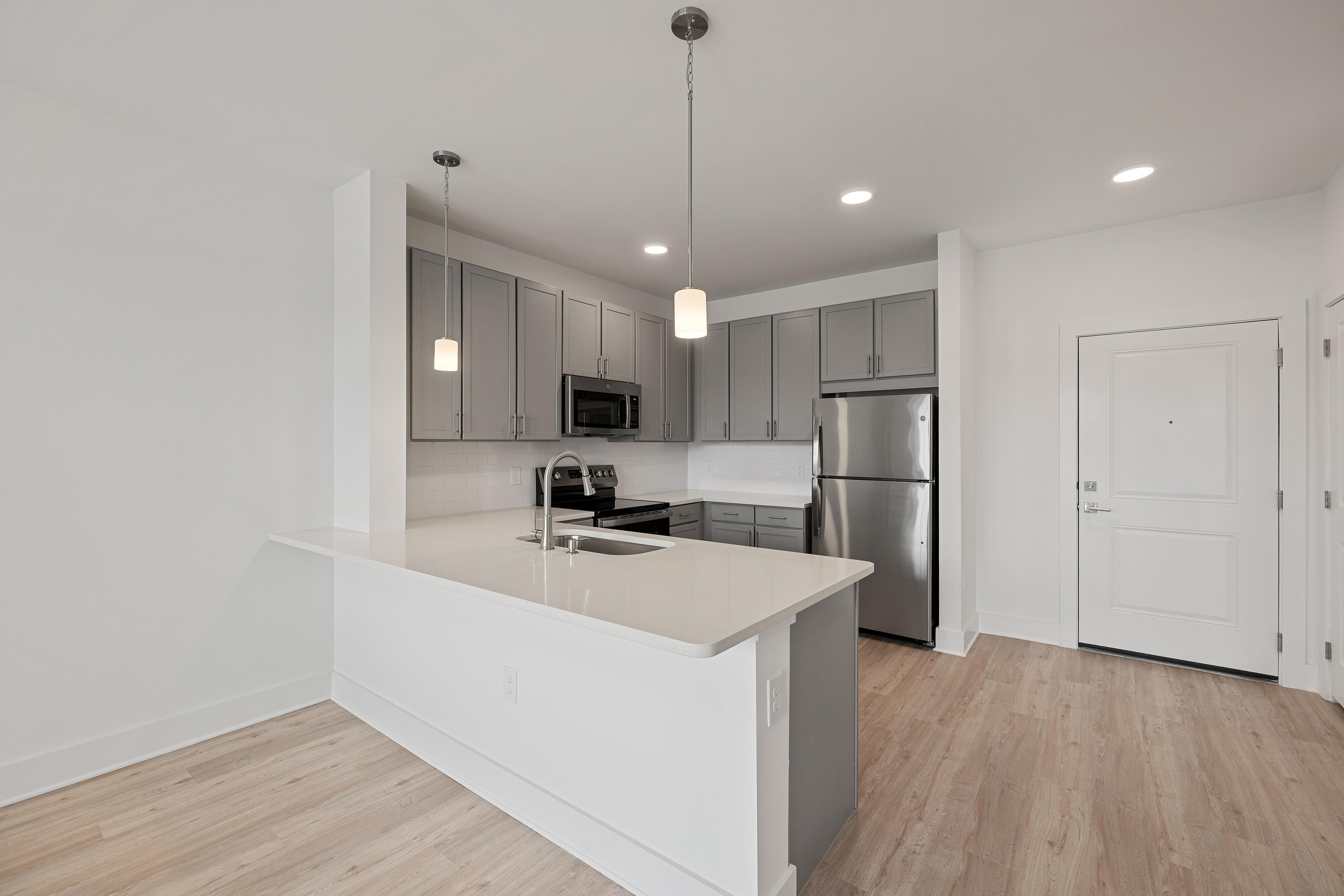 vacant kitchen with gray cabinets