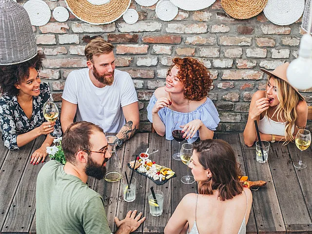 a group of people eating and drinking