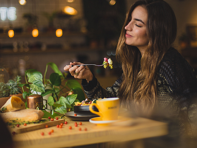 Girl eating at a nice restaurant