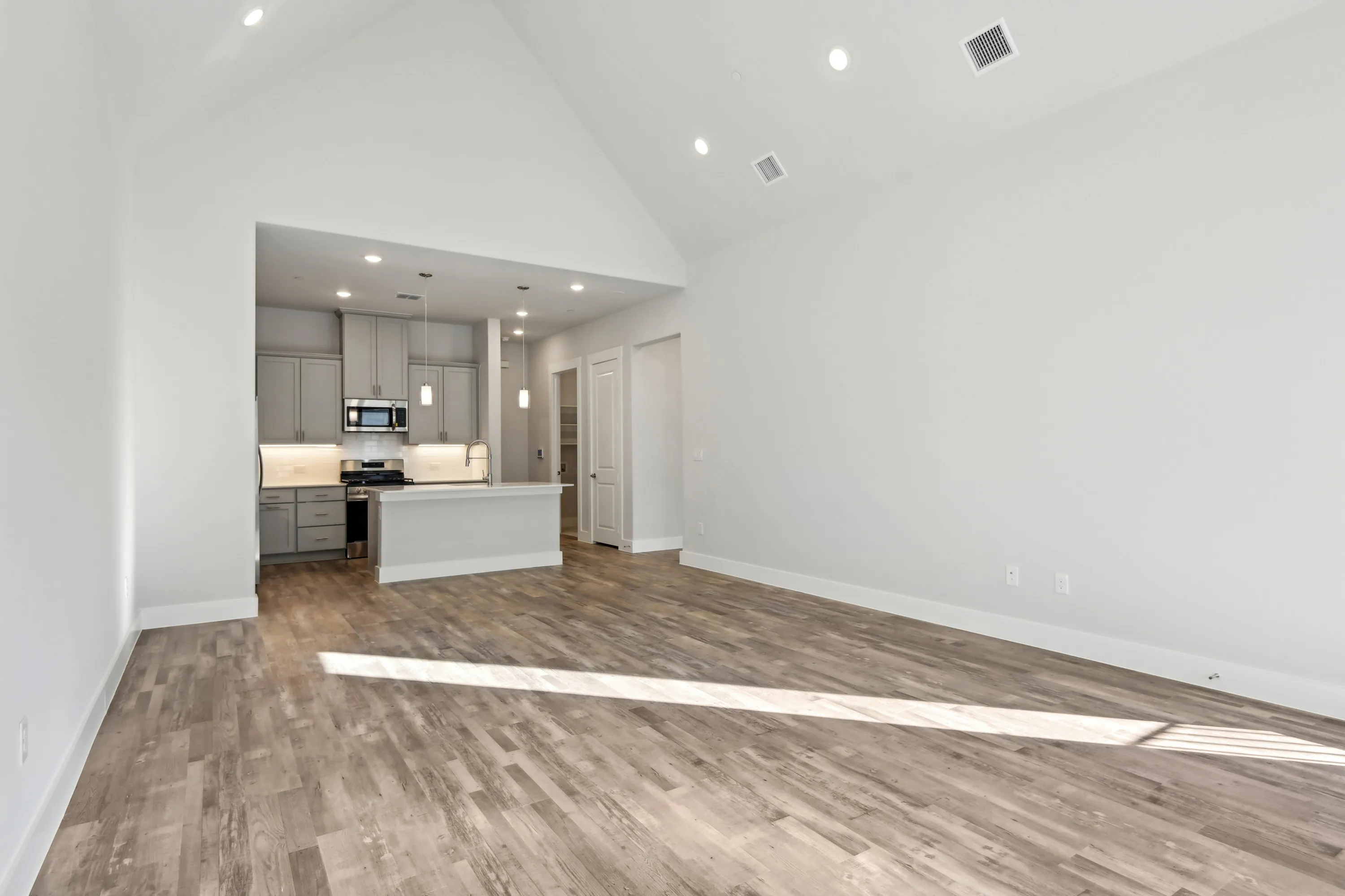 Open layout and spacious living area with wood style flooring