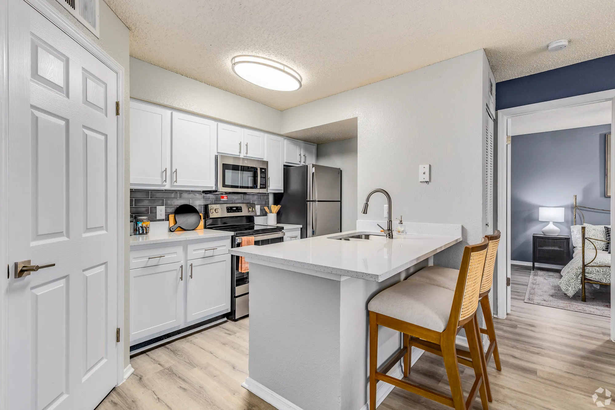 white cabinet kitchen with upgraded appliances