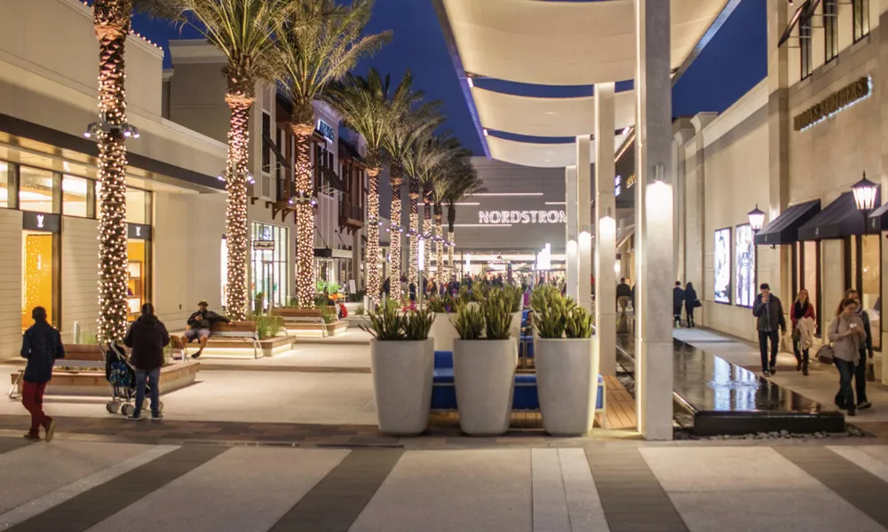 people walking around in town center at nighttime