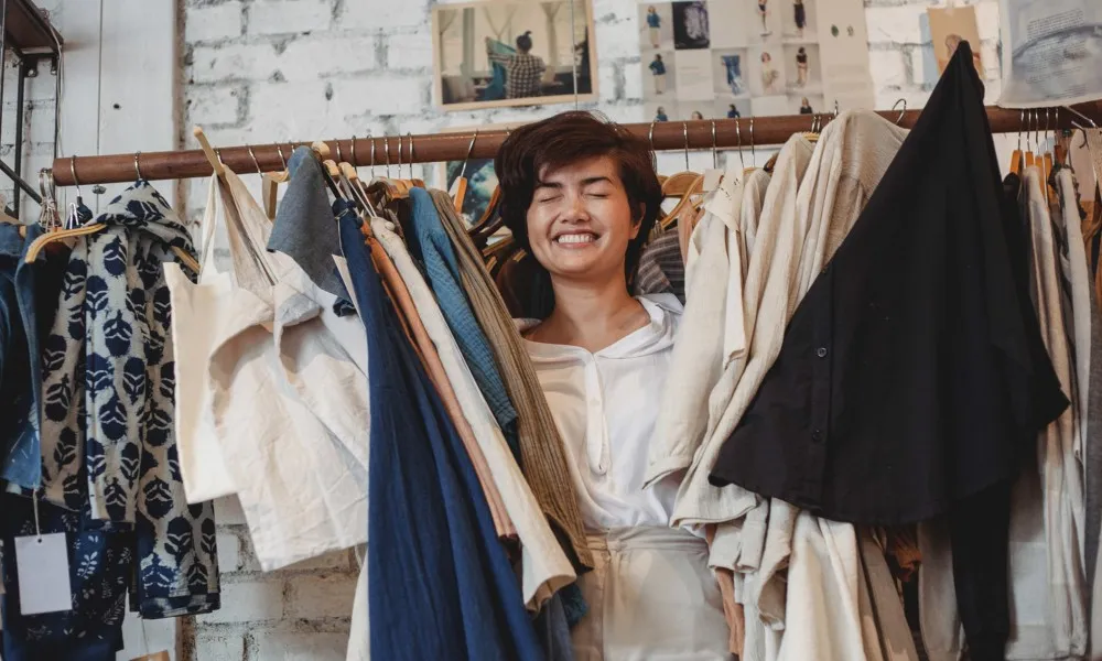 woman with rack of clothes