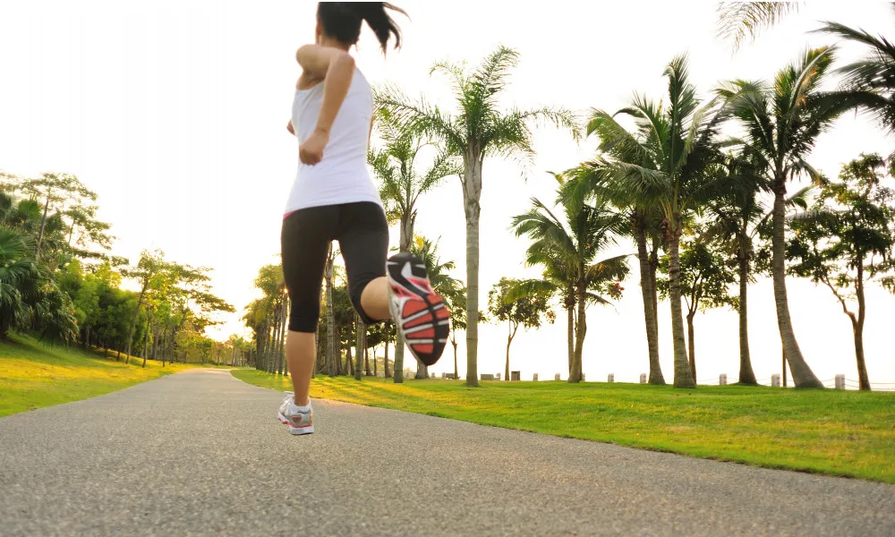 Girl running on path outdoors in day light