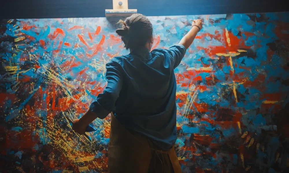 artist painting a large painting