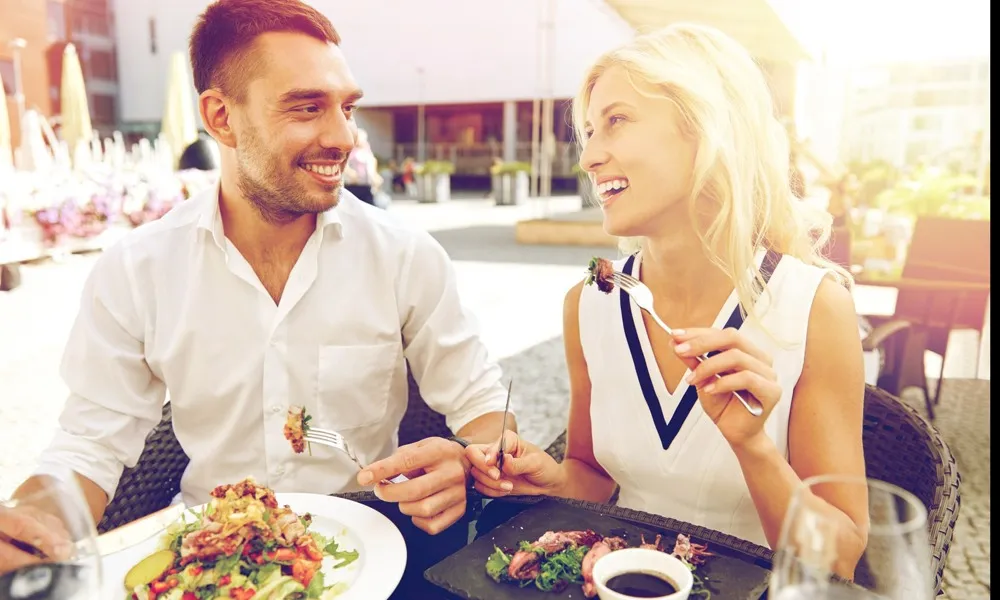 couple eating at restaurant outdoors