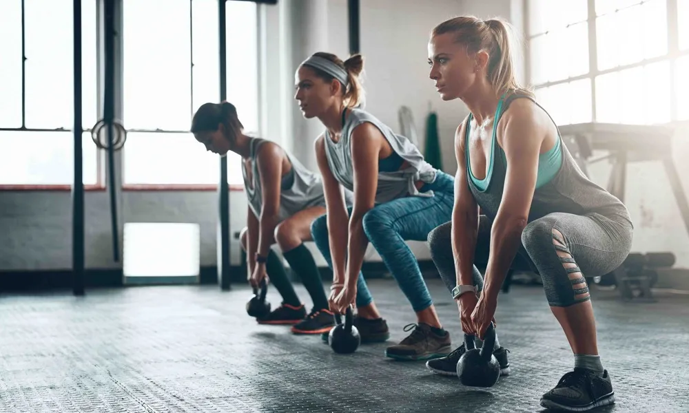 three women working out