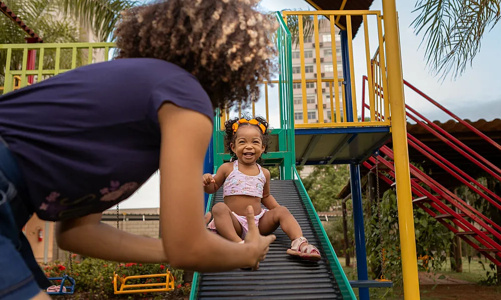 Mom and daughter at a kid playground
