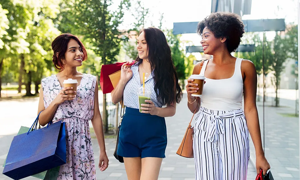 three women shopping outside