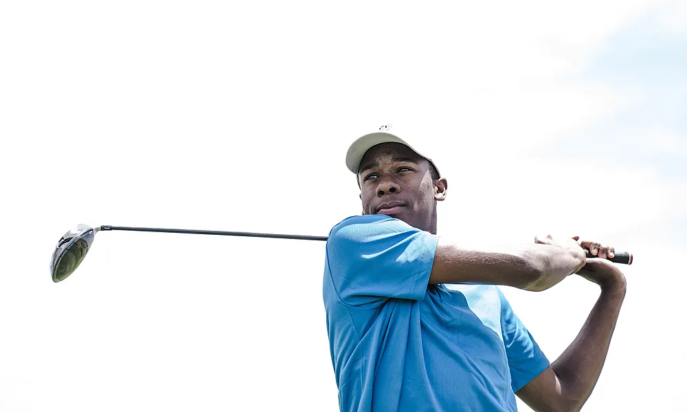 man swinging a golf club