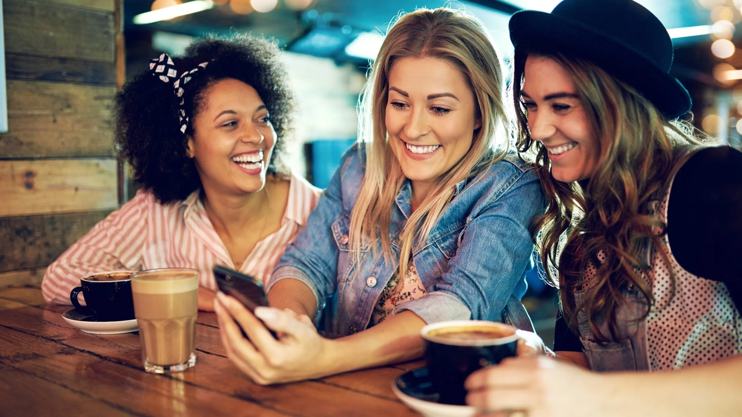 girls looking at phone