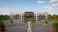 Modern apartment complex exterior with ample parking, lush greenery, and an inviting entrance under a bright blue sky.