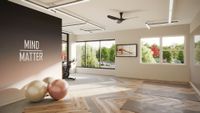 Tranquil home gym with large windows, exercise balls, and motivational decor, perfect for an energizing workout.