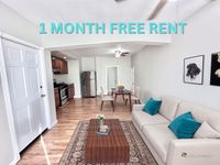 Inviting apartment interior with modern kitchen, cozy living area, and stylish dining space, offering 1 month free rent.