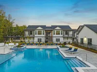 Outdoor pool with view of exterior of community