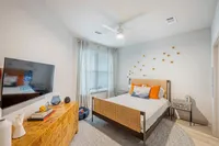 Furnished bedroom with bed and tables