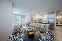 Furnished kitchen with large island and dining room table