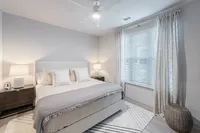 Furnished bedroom with bed and tables