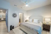 Furnished bedroom with bed and tables