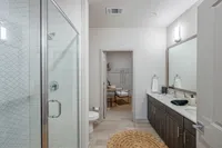 Furnished bathroom with walk-in shower
