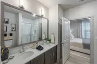 Furnished bathroom with double vanity