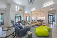 indoor community ckub house with many seating options and open concept