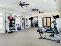 Bright and modern fitness center with state-of-the-art equipment and exercise facilities.