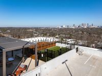 Stunning rooftop terrace with lounge area and city skyline views, perfect for relaxation and entertaining.