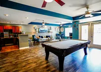 The Reserve's clubhouse includes billiards, a coffee bar, and entertainment/lounge space.
