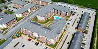 The Reserve Apartments and Townhomes include a number of amenities, including a clubhouse, pool, two dog parks, and garages.