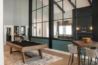 The clubhouse is a community space for residents to relax, play games, shoot pool, or work.