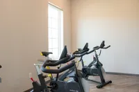 The Nese fitness center includes a private cycling room with spin bikes.
