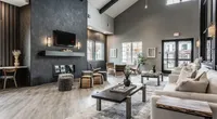 The Nese clubhouse includes a cozy lounge for residents to relax, read, play games, or gather with friends and neighbors.