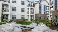 Nese's communal spaces include a cozy outdoor lounge with a firepit.