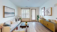 Nese features open-concept floor plans with large living spaces and private patio/balconies.
