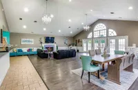 The clubhouse is available to residents and includes a full kitchen, fireplace, and dining area.
