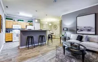 Most floor plans are open-concept with large kitchen islands and breakfast bars.