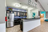 The clubhouse's full kitchen and coffee bar are available for residents to use.