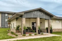 Meticulously maintained landscaping surrounds the Legacy Landing clubhouse, creating a peaceful and polished community entrance.