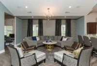 From lounging to productivity—this open-concept clubhouse connects seamlessly to the community kitchen and business center.
