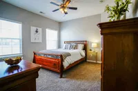 Rest easy in a spacious, light-filled primary bedroom at The Bristol Apartments in Camby, IN — designed for comfort, style, and everyday living.