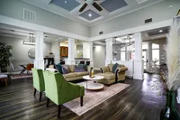 Whether you’re hosting or relaxing, the clubhouse at The Bristol offers welcoming spaces like a community kitchen, dining area, and comfortable lounge seating.