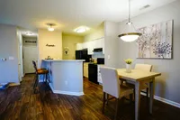 Discover an open-concept layout where the kitchen meets the dining room. A bright breakfast bar/half wall creates a natural separation while keeping the space connected.