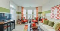 This living room shows off all the natural light — plus, a door that opens to your private balcony or patio.