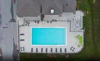 From above: the full picture of your outdoor space, complete with pool, lounge, grill, and room to unwind.