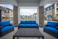 Cozy seating with a poolside view—your favorite hangout spot, day or night.